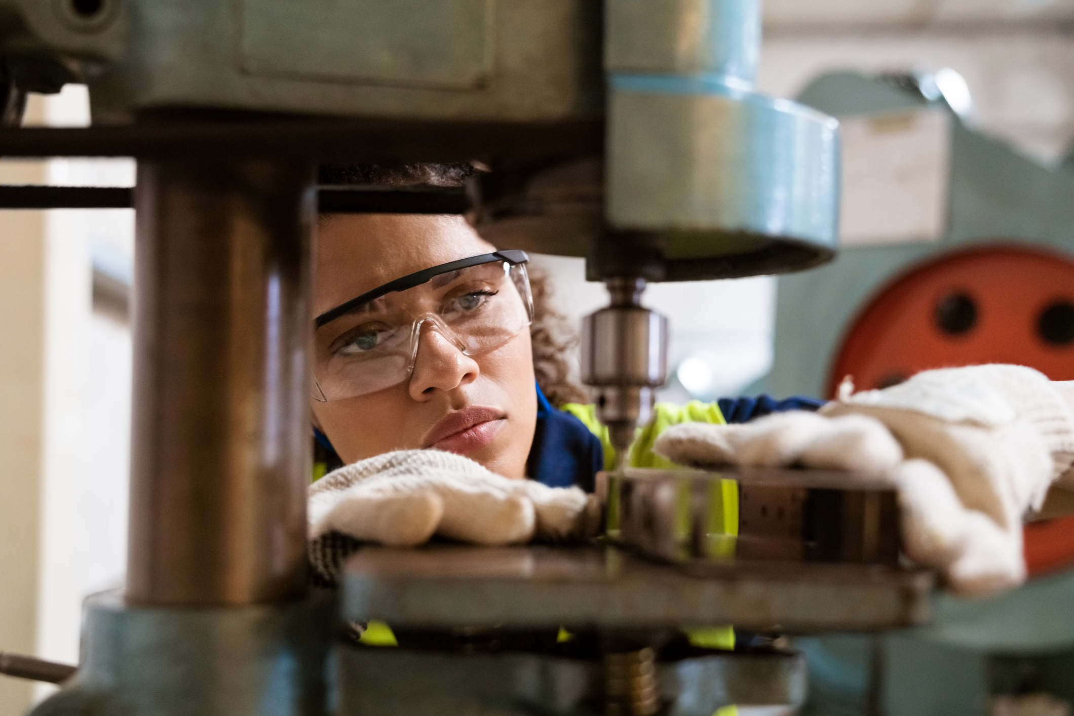 Manufacturing worker wearing eye protecting goggles